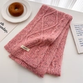 Detailed knit texture and logo patch on a pink purple chunky cable knit scarf - Pink