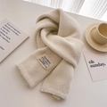 Detail view of cream knit scarf texture with brand label on a cozy white desk setup - 156x24cm / White