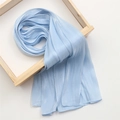 Detail of light blue cotton linen scarf showing vertical pleated texture and silky finish - 180x70cm / Blue