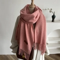 Solid coral pink fringed scarf with leather logo patch on a classic mannequin - Pink Heather