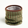Detail of winter houndstooth knit neck warmer with thick gray fleece lining texture - Green