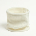 Macro detail of creamy white waffle knit texture on a thick winter neck warmer scarf - White