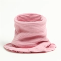 Close-up of pink knit neck warmer with ribbed texture and decorative ruffled hem edges - Pink