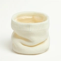 Detail of soft white knitted neck warmer with thick faux fleece lining for winter - White
