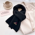 Close-up of black knitted scarf featuring delicate puppy embroidery on wool blend fabric - 164x20cm / Black