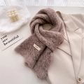 Detail of soft wool knit scarf with BONOGEED brand label on elegant warm beige fabric - 166x20cm / Oatmeal