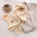 Close-up of knit scarf showing cute puppy embroidery and soft ribbed edge texture - 164x20cm / Beige