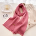 Detail of rose pink knit scarf with soft fringe and brown handmade leather label - Pink