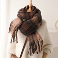 Macro detail of the brown plaid scarf showing thick cashmere texture and fringe tassels - Latte Brown