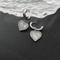 Elegant heart earrings with mother of pearl inlay and silver-toned metal hoops - Silver