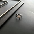 Minimalist silver bow-shaped titanium steel ring for women in a sleek polished finish - Silver