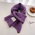 Deep purple knitted wool scarf with minimal brand tag on a soft white background - 156x24cm / Purple