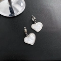 Boucles d'oreilles cœur argentées avec incrustation en nacre blanche pour femme - Argenté