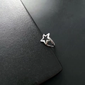 Adjustable silver finish ring featuring a hollow star design crafted in titanium steel - Hollow Star / Silver