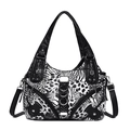 Schwarz-weiße Schultertasche mit Leopardenmuster, Zebramotiven und Nietendetails - Schwarz