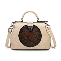 Vintage beige embossed floral handbag with a round brown plaque and crossbody strap - White
