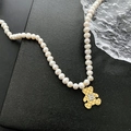 Titanium steel necklace with white natural pearls and golden bear pendant with letter B - Bear Natural Pearl Necklace (04-D11)