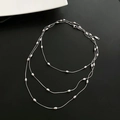 Three-layer silver stainless steel necklace with polished oval bean charms on fine chains - Silver Long Necklace (06-K11)