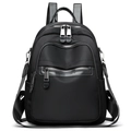Zaino classico in nylon nero con scomparti multi-zip e dettagli metallici argentati - Nero