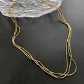 Collana dorata a tre strati minimalista con piccole perline su catene sottili - Oro