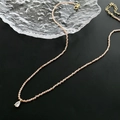 Elegante champagne kralenketting met een peervormige zirkoon hanger en gouden sluiting - Zirkoon Waterdruppel Hanger Oranje Kralen Ketting (04-D3)