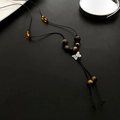 Collana in corda intrecciata retrò con ciondolo a farfalla d'argento e perle occhio di tigre - Collana Fiocco Intrecciato