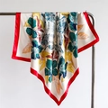 Detail of tropical floral print silk scarf with vibrant red borders on a hanger - 90x90cm / Red (FT259-5)