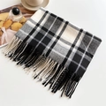 Detail of classic black and white plaid scarf with soft fringe and cashmere-like texture - Black and White