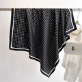 Close-up of black silk scarf with white polka dots and stripe border on a metal rod - 90x90cm / Black (FN219-5)