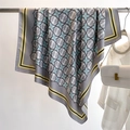 Detail of grey silk scarf featuring twill texture with blue stars and double C print - Stone Grey