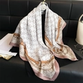 Elegant 90cm monogram silk scarf with golden chain print and soft pink border - White