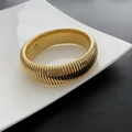 Exaggerated wide golden stainless steel bracelet featuring vertical textured ridges - Gold Style A (01-I6)