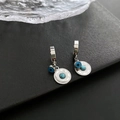 Elegant gold hoop earrings with blue evil eye and turquoise sunburst pendants - Silver