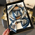 Detail of silk scarf with orange floral and blue paisley patterns on elegant tray - Orange Floral Navy Blue Paisley (LJ21-H184)
