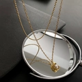 Double-layered gold titanium necklace with elegant pearl pendant on a mirror background - Pearl Pendant Double Layer Style (01-C1)