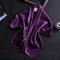 Close-up of deep purple satin scarf draped on a wooden hanger with silky texture - Dark Purple