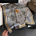 Paisley pattern silk square scarf with orange borders displayed on a stylish desk - 70x70cm / Grey Orange Black Paisley (FJ887-2)