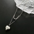 Elegant silver double-layer stainless steel heart necklace on minimalist black background - 04-E17 Titanium Steel Heart Double Layer Necklace Silver