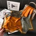 Luxurious orange and brown geometric silk scarf draped over a stylish leather handbag - Orange Brown Patchwork (FJ896-3)