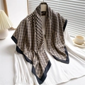 Classic houndstooth and chain print silk scarf draped on a white shirt in a home setting - Brown (FN220-4)