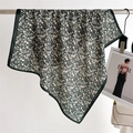 Detail of elegant floral silk scarf draped on a rack with dark green borders and pattern - 68*68cm / Dark Green (FR40-2)