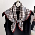 Elegant houndstooth and floral silk scarf styled on a dress for a luxury fashion look - Gray