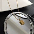 Collana dorata con pendente rettangolare inciso Smile e icona sorriso su catena fine - Collana a Doppia Faccia in Acciaio al Titanio e Conchiglia / Oro