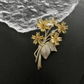 Golden flower bouquet brooch with yellow crystals and red accents on black background - Yellow Flower Style (116#XZ)