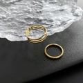 Gold two-piece titanium ring set with a hollow cutout wide band and a slim round band - US 7 / Gold