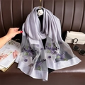 Detail of lilac scarf featuring mesh patchwork, floral embroidery, and pearl accents - Gray