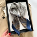 Vintage geometric paisley silk square scarf displayed in a black gift box on a beige trench coat - 70x70cm / Blue (FJ777-2)