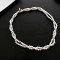Double-layered faux pearl sweater necklace with gold accent beads on black background - Long Imitation Pearl Sweater Chain (04-G12)