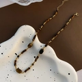 Collana di perline in occhio di tigre con distanziali dorati e chiusura a moschettone - Collana di Perline in Occhio di Tigre di Forme Miste Vintage (03-B7)