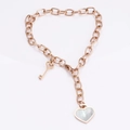Bracciale in oro rosa con ciondolo a cuore in conchiglia e chiave in acciaio - Oro rosa